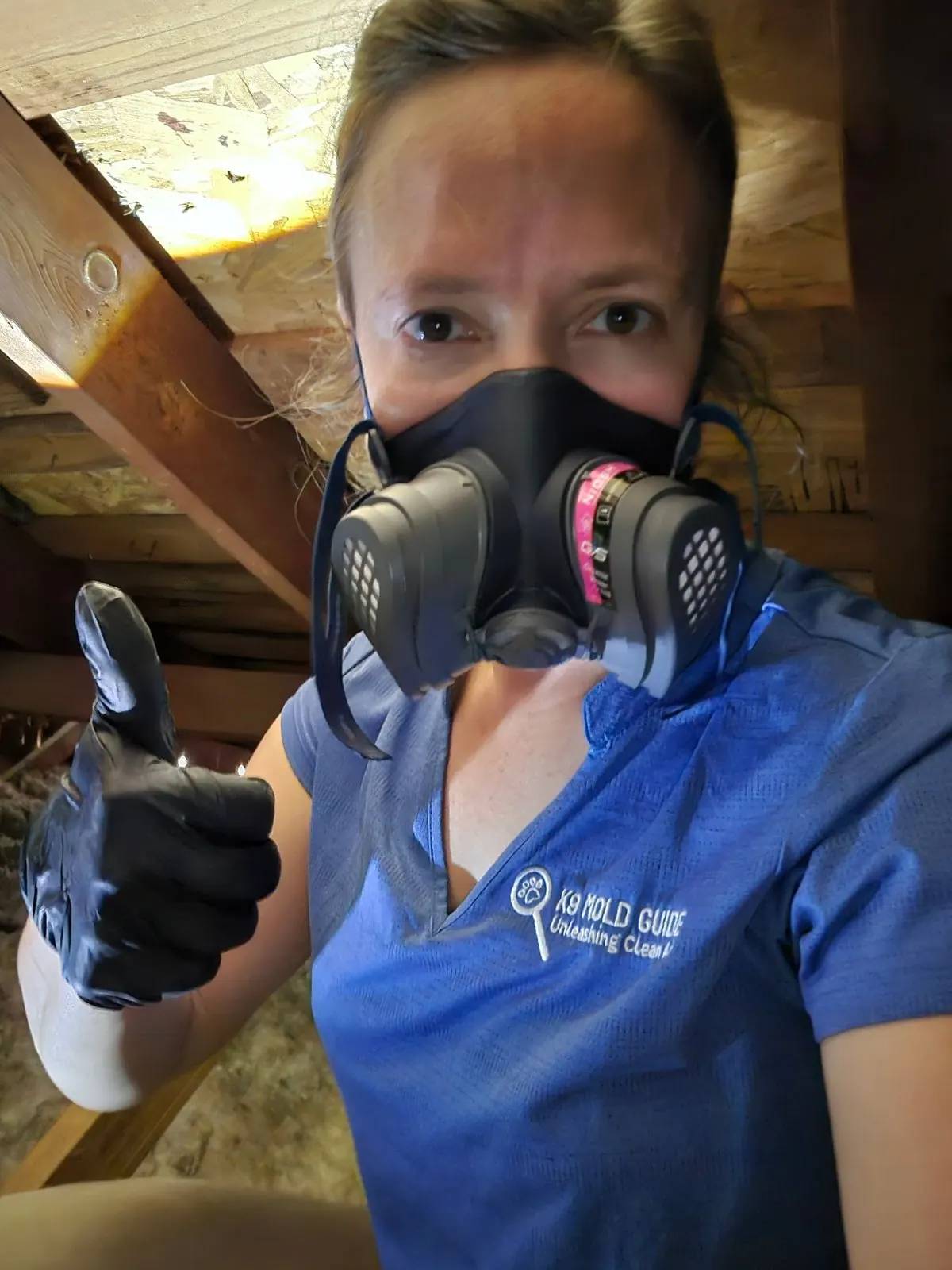 Taylor of K9 Mold Guide inspecting an attic during a mold investigation